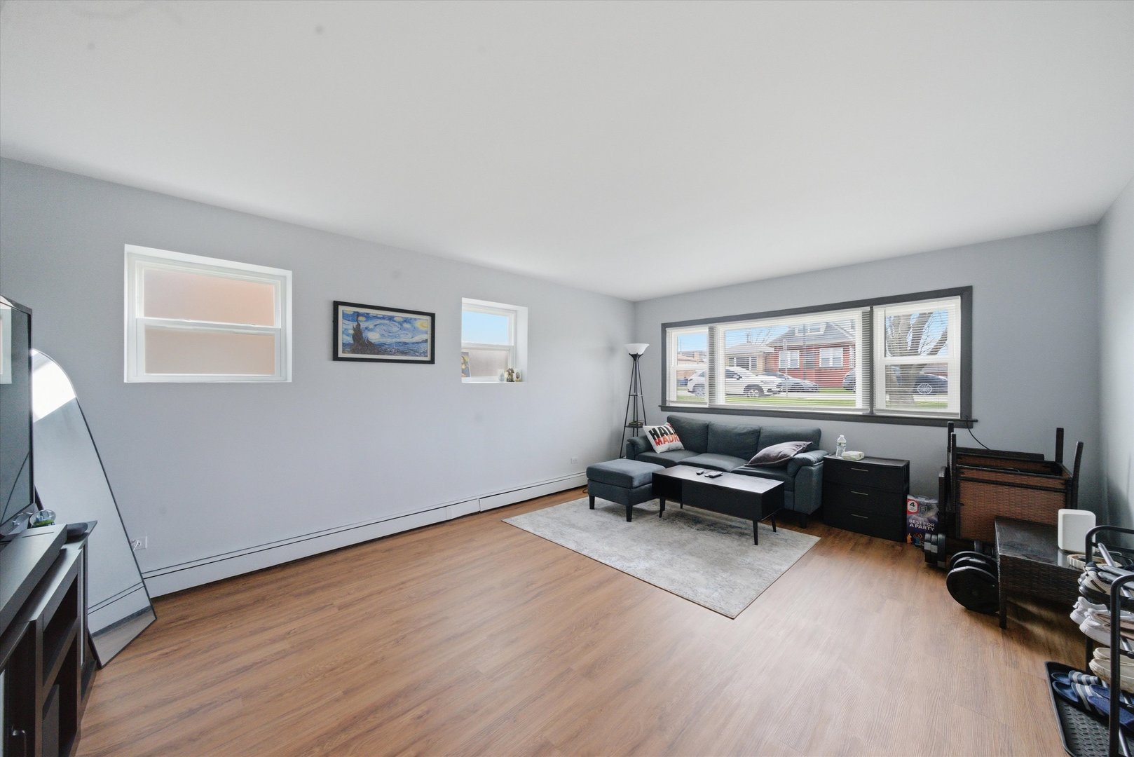 7412 West 63rd Place Summit, IL 60501 - Photo 7 of 49 a living room with furniture and a window