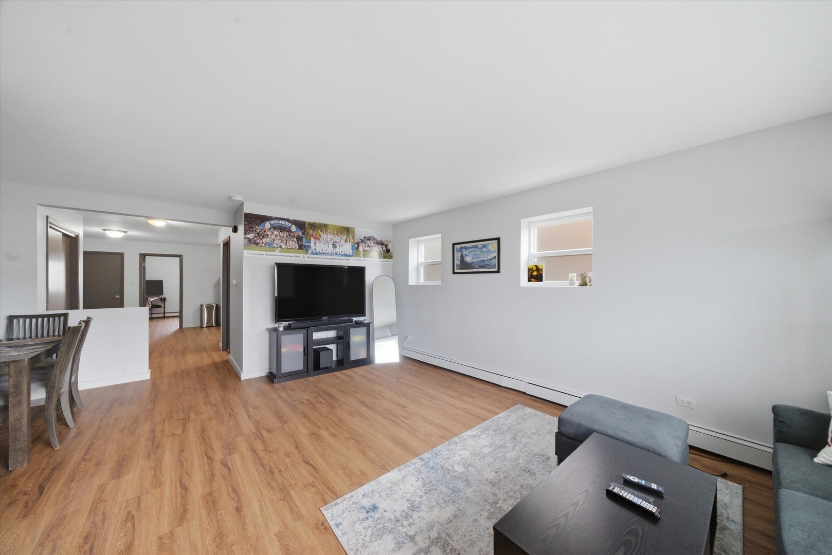 7412 West 63rd Place Summit, IL 60501 - Photo 8 of 49 a living room with furniture and a flat screen tv