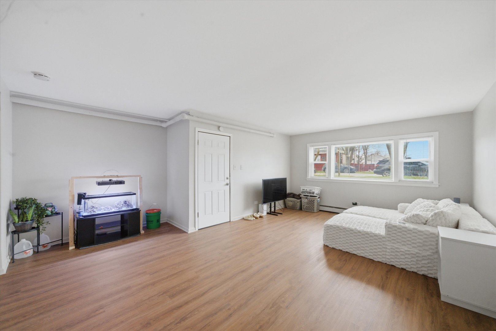 7412 West 63rd Place Summit, IL 60501 - Photo 10 of 49 a bedroom with furniture and a wooden floor