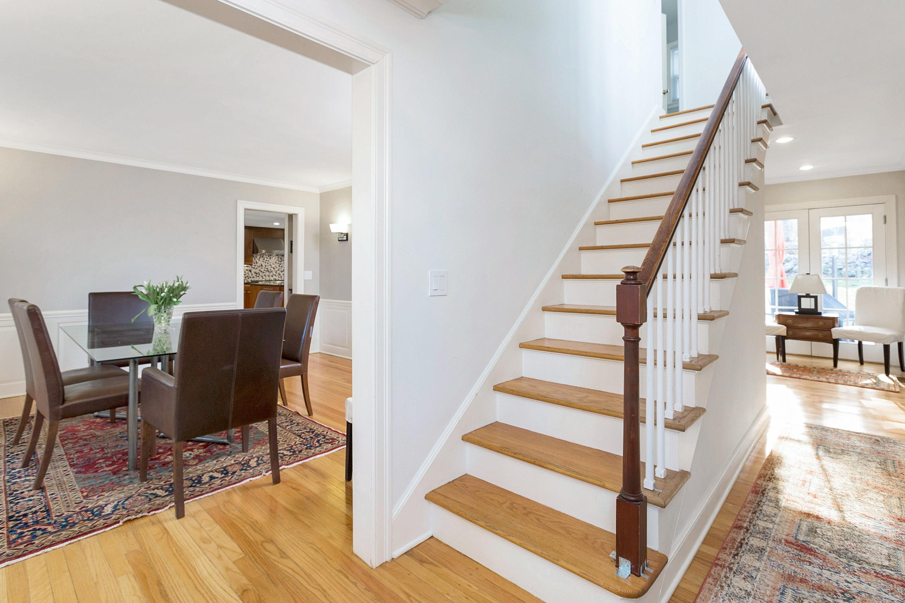 534 Valley Road New Canaan, CT 06840 - Photo 14 of 31 a view of a livingroom with furniture and staircase