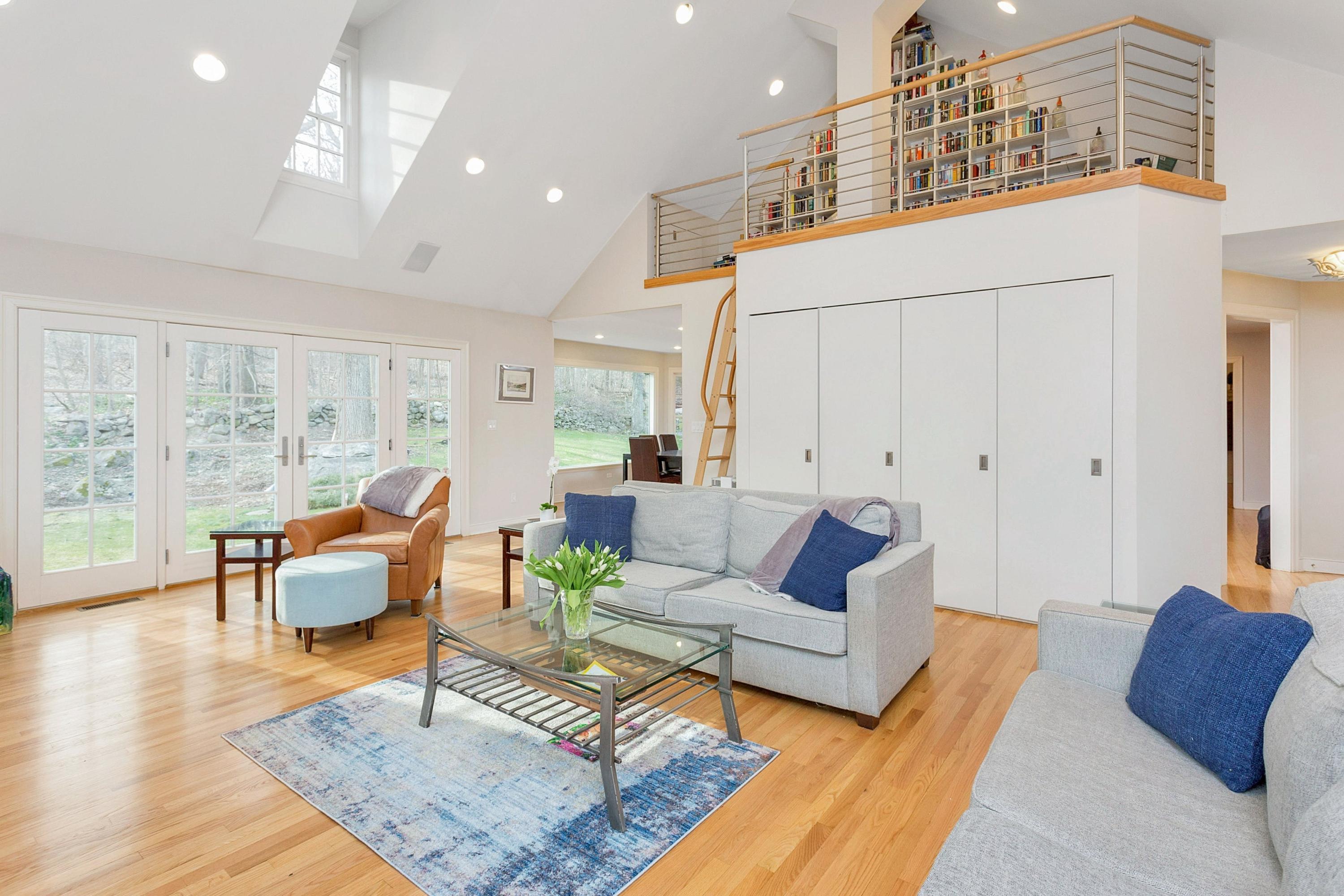 534 Valley Road New Canaan, CT 06840 - Photo 3 of 31 a living room with furniture and wooden floor