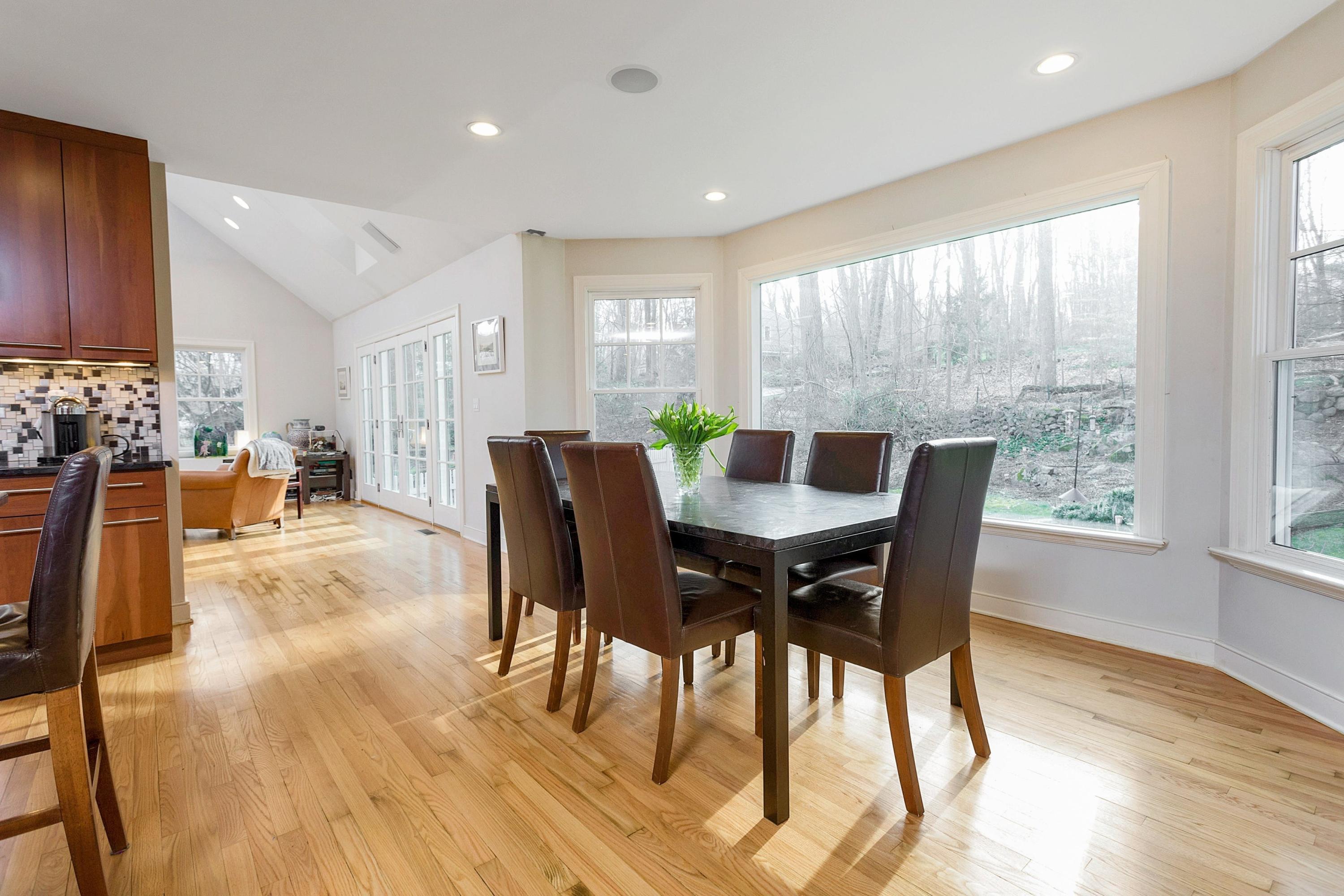 534 Valley Road New Canaan, CT 06840 - Photo 8 of 31 a view of a dining room with furniture and wooden floor
