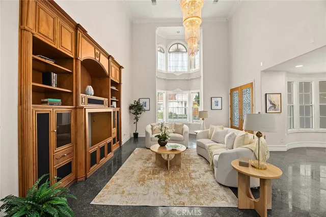 a living room with furniture a rug and a flat screen tv