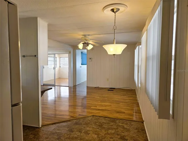 a view of a room with wooden floor and stairs
