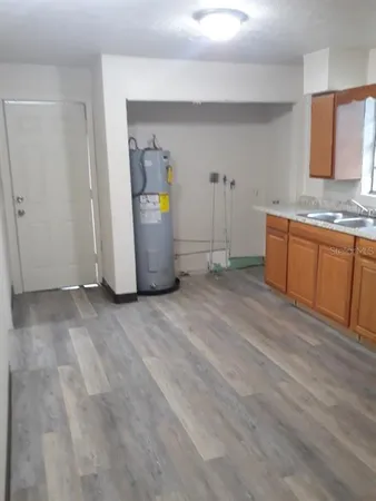 a view of a storage and utility room with window
