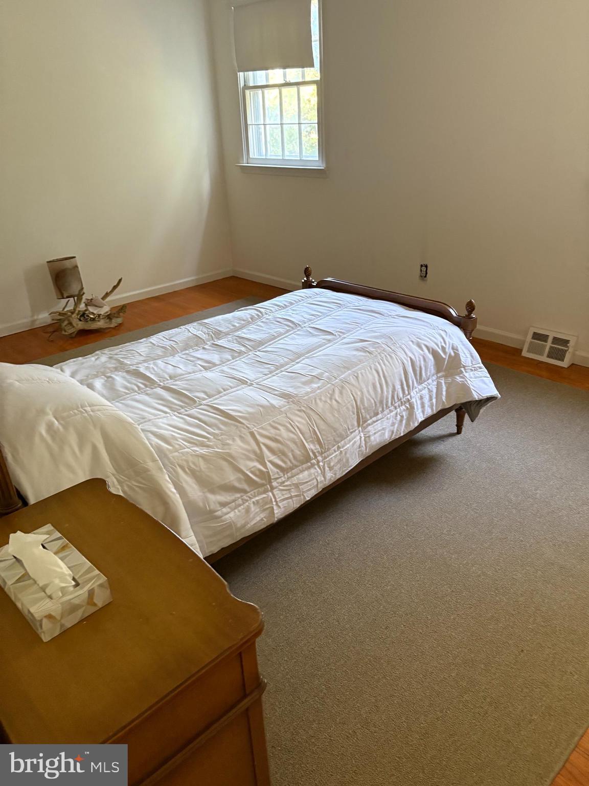 658 West Rolling Road Springfield, PA 19064 - Photo 14 of 15 a bed sitting in a bedroom next to a window