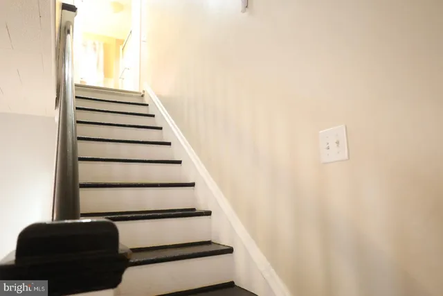 a kitchen with stainless steel appliances granite countertop a refrigerator and a stove