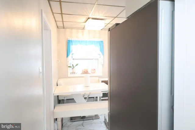 a bathroom with a toilet a sink and a mirror