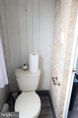 a dining room with furniture and chandelier