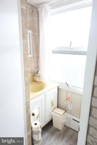 a bed room with a bed and a chair