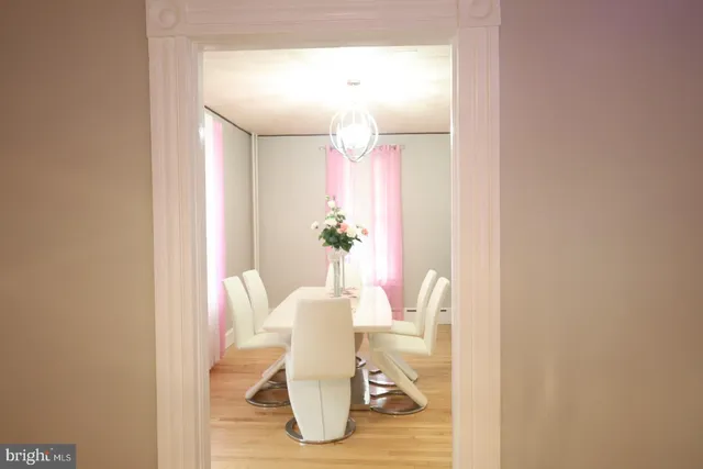 a bedroom with a bed dresser and a window