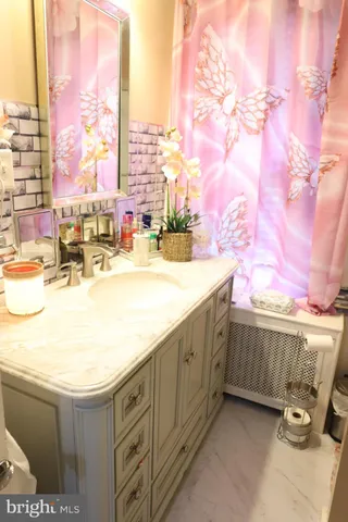 a spacious bathroom with a bathtub