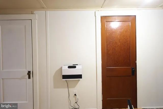 a living room with furniture and stairs