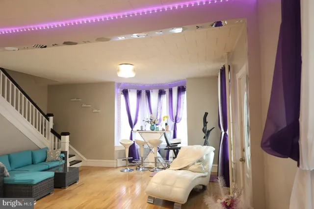 a bedroom with a bed mirror and window