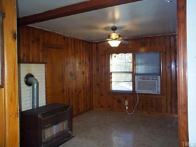 434 Allensville Road Roxboro, NC 27574 - Photo 5 of 9 wooden floor in an empty room with a window