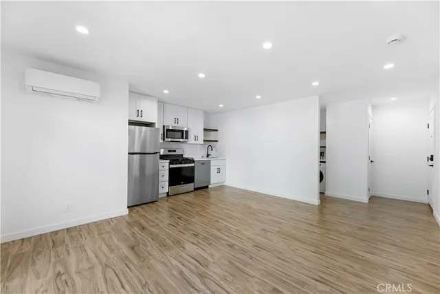 a view of kitchen with wooden floor