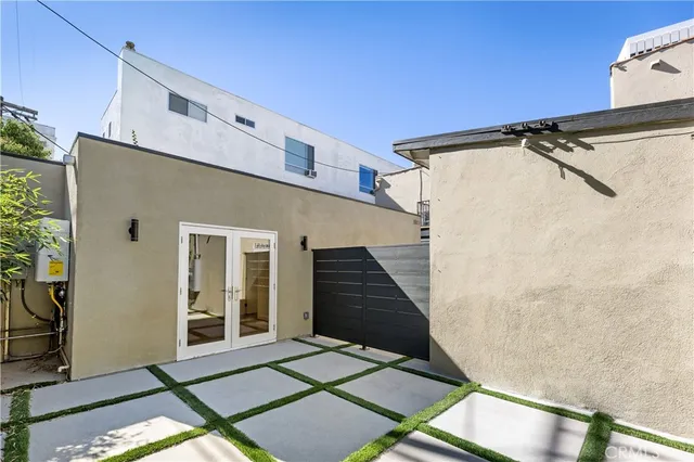 a view of a house with a door and wooden floor