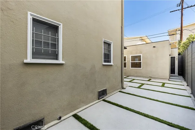 a view of a house with entryway and a wooden floor