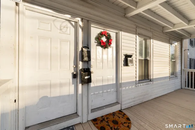 a kitchen with a refrigerator and a stove