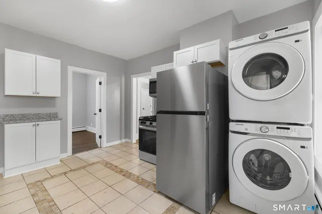 a kitchen with stainless steel appliances granite countertop a stove and a microwave