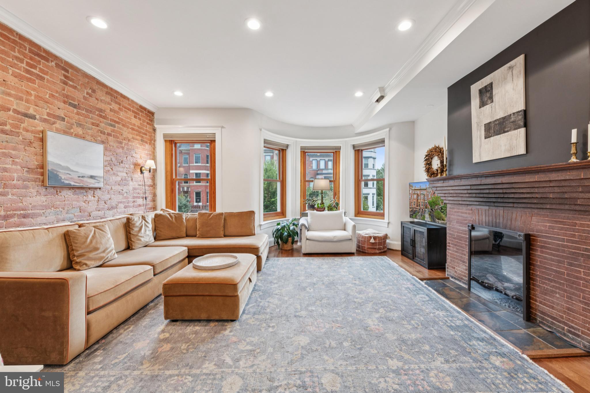 2304 1st Street Northwest, Unit 1 Washington, DC 20001 - Photo 6 of 21 Enormous living room with exposed brick and firepl