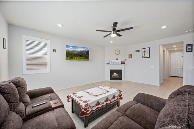 a bedroom with furniture and a fireplace