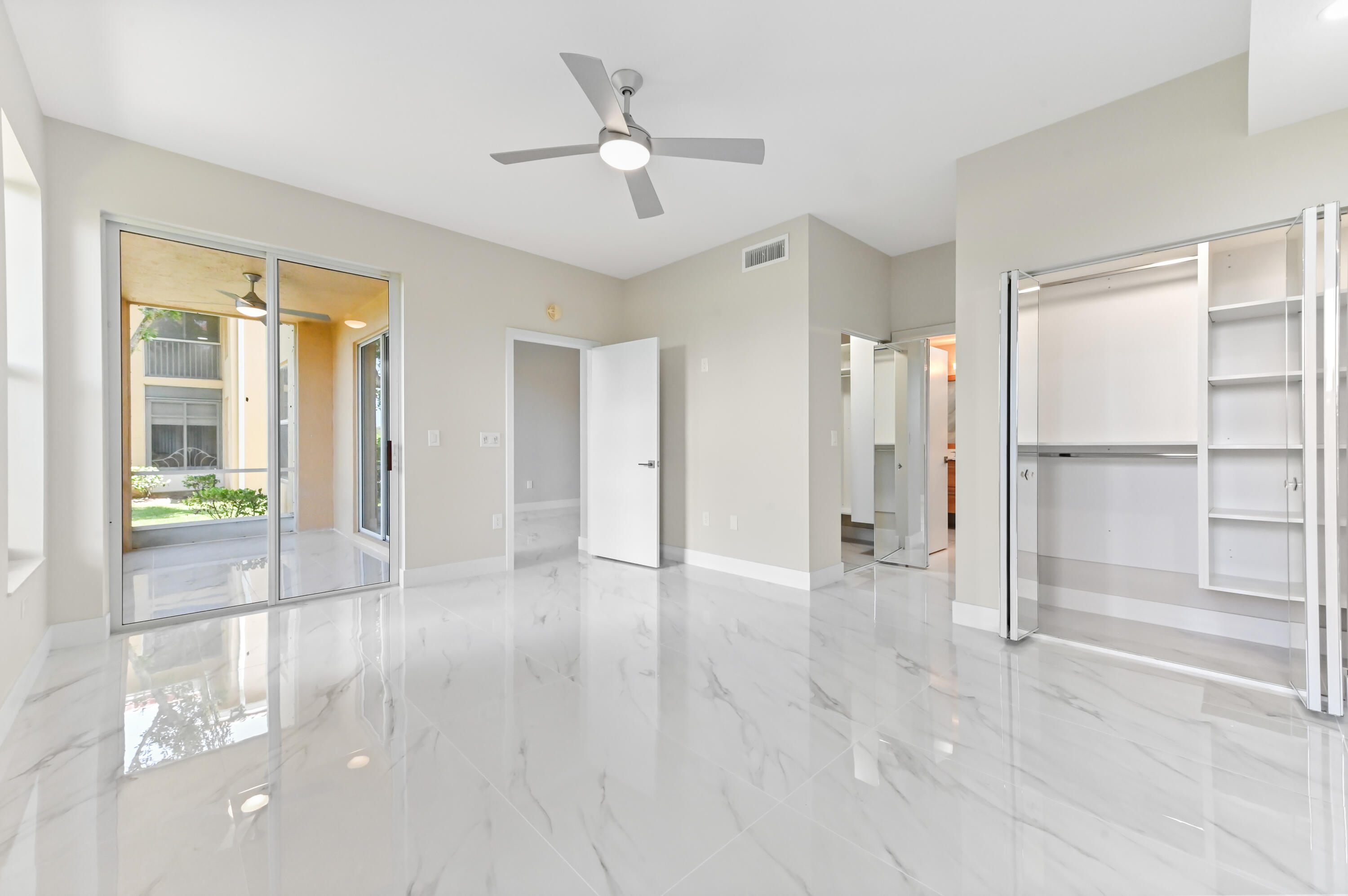 12510 Crystal Pointe Drive, Unit 102 Boynton Beach, FL 33437 - Photo 22 of 27 a view of an empty room with a window