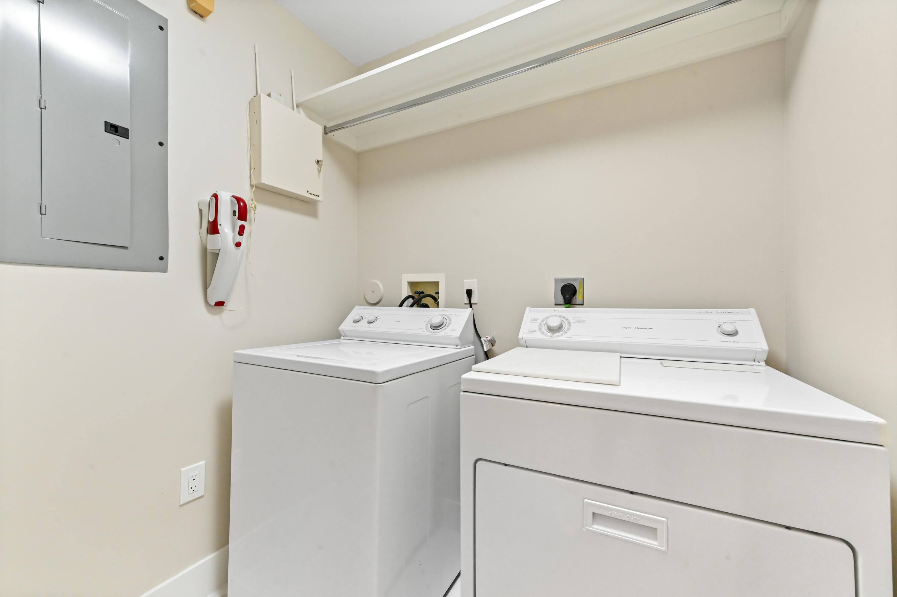 12510 Crystal Pointe Drive, Unit 102 Boynton Beach, FL 33437 - Photo 24 of 27 a utility room with dryer and washer