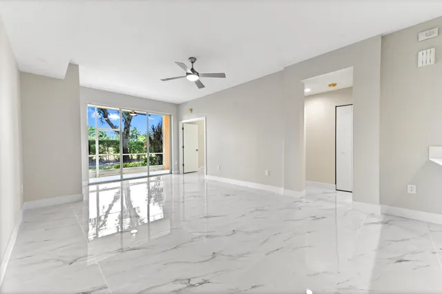 a view of an empty room with a window