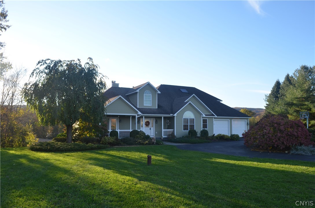 Welcome home! Two car garage with a circle drivewa
