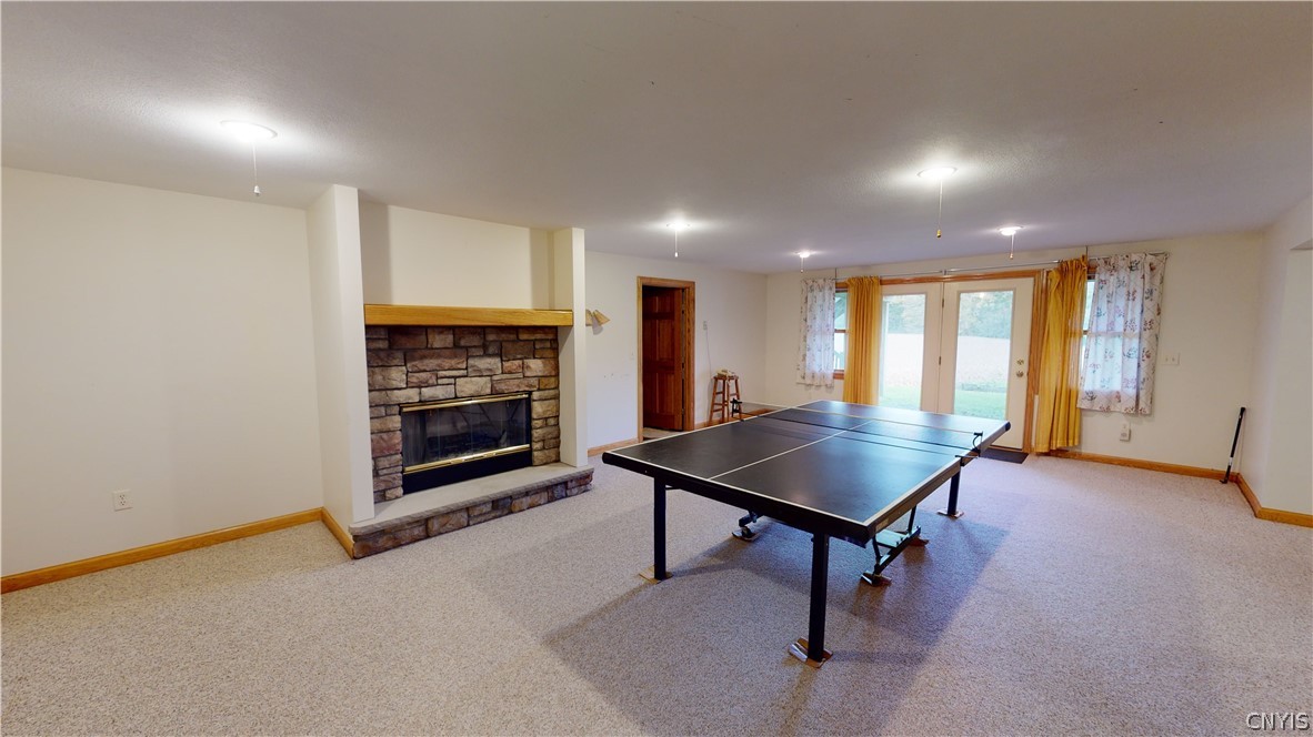 5479 Lake Road Tully, NY 13159 - Photo 37 of 41 The basement rec room, with a real wood burning fi