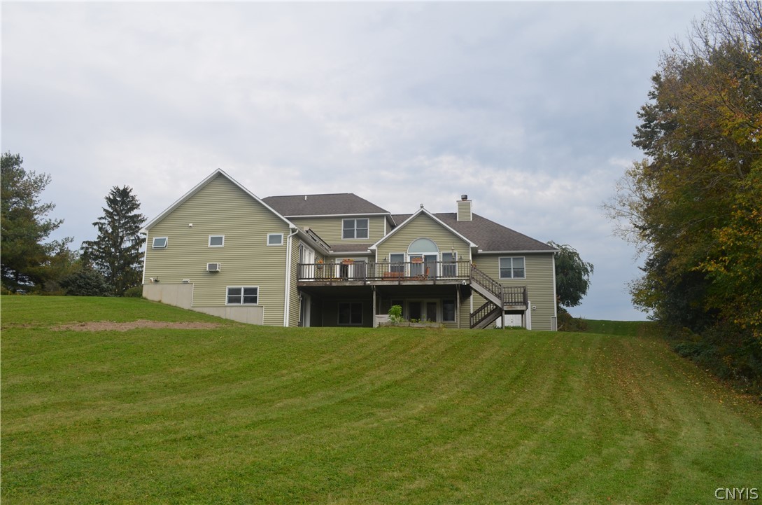 5479 Lake Road Tully, NY 13159 - Photo 4 of 41 The view of the back of the house from the yard