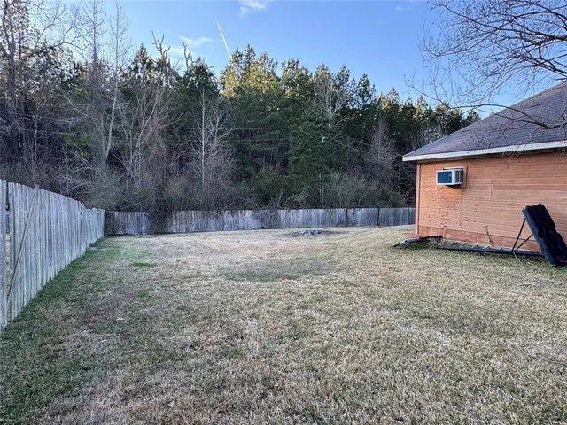 a view of backyard and tree