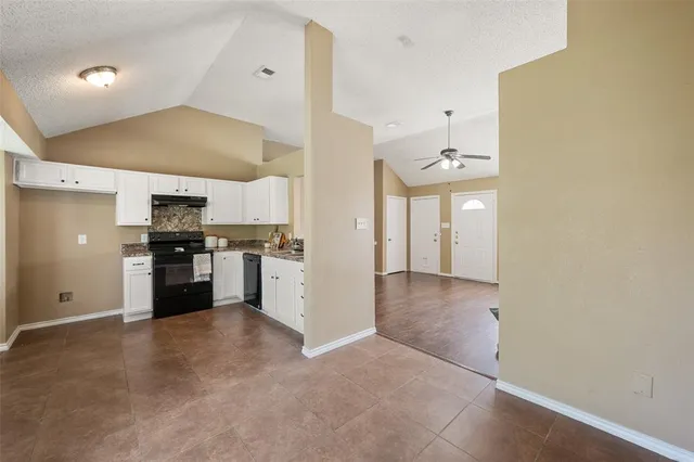a view of a kitchen with a sink and an oven