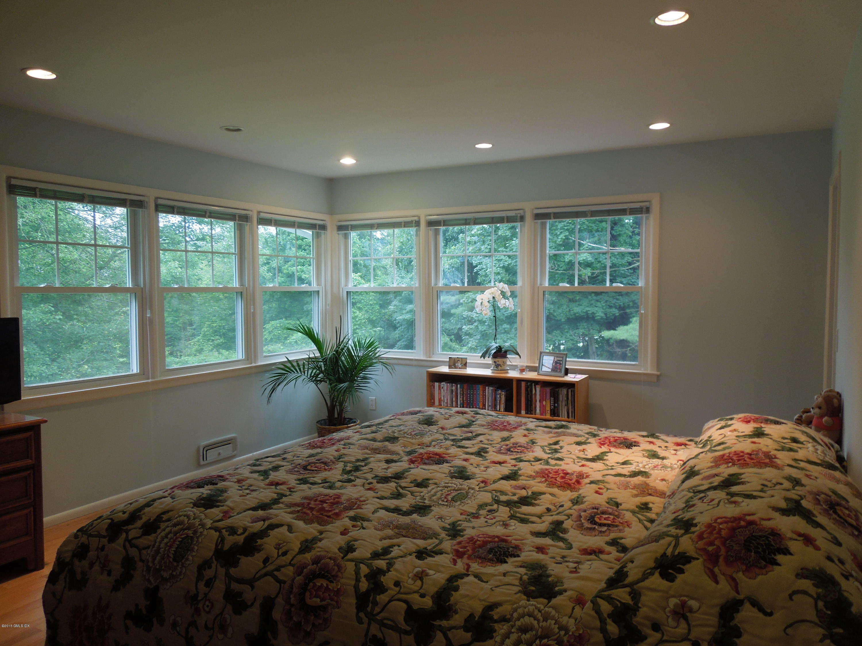 408 Taconic Road Greenwich, CT 06831 - Photo 11 of 18 a bed sitting in a bedroom next to a window