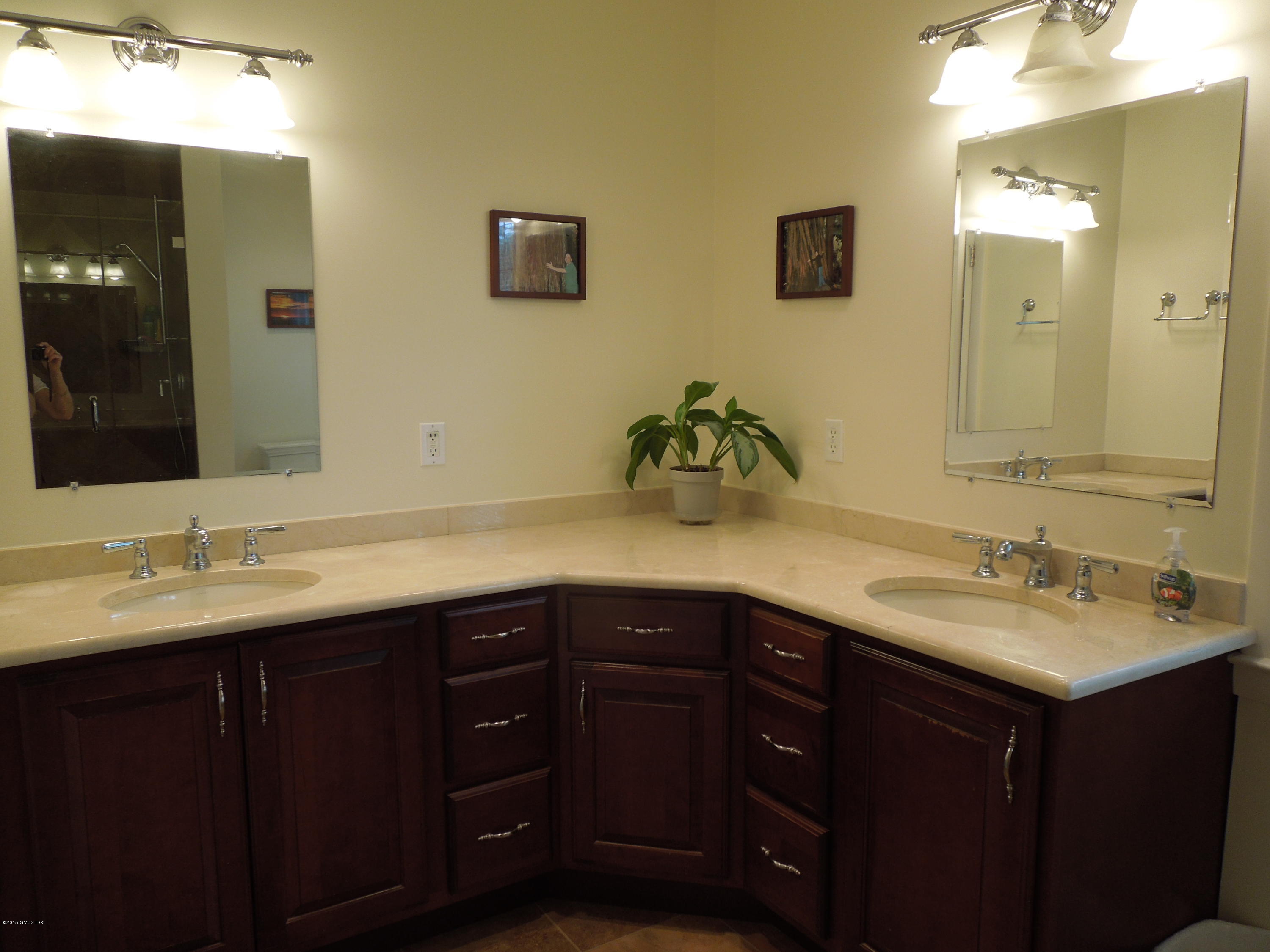 408 Taconic Road Greenwich, CT 06831 - Photo 12 of 18 a bathroom with a double vanity sink and a mirror