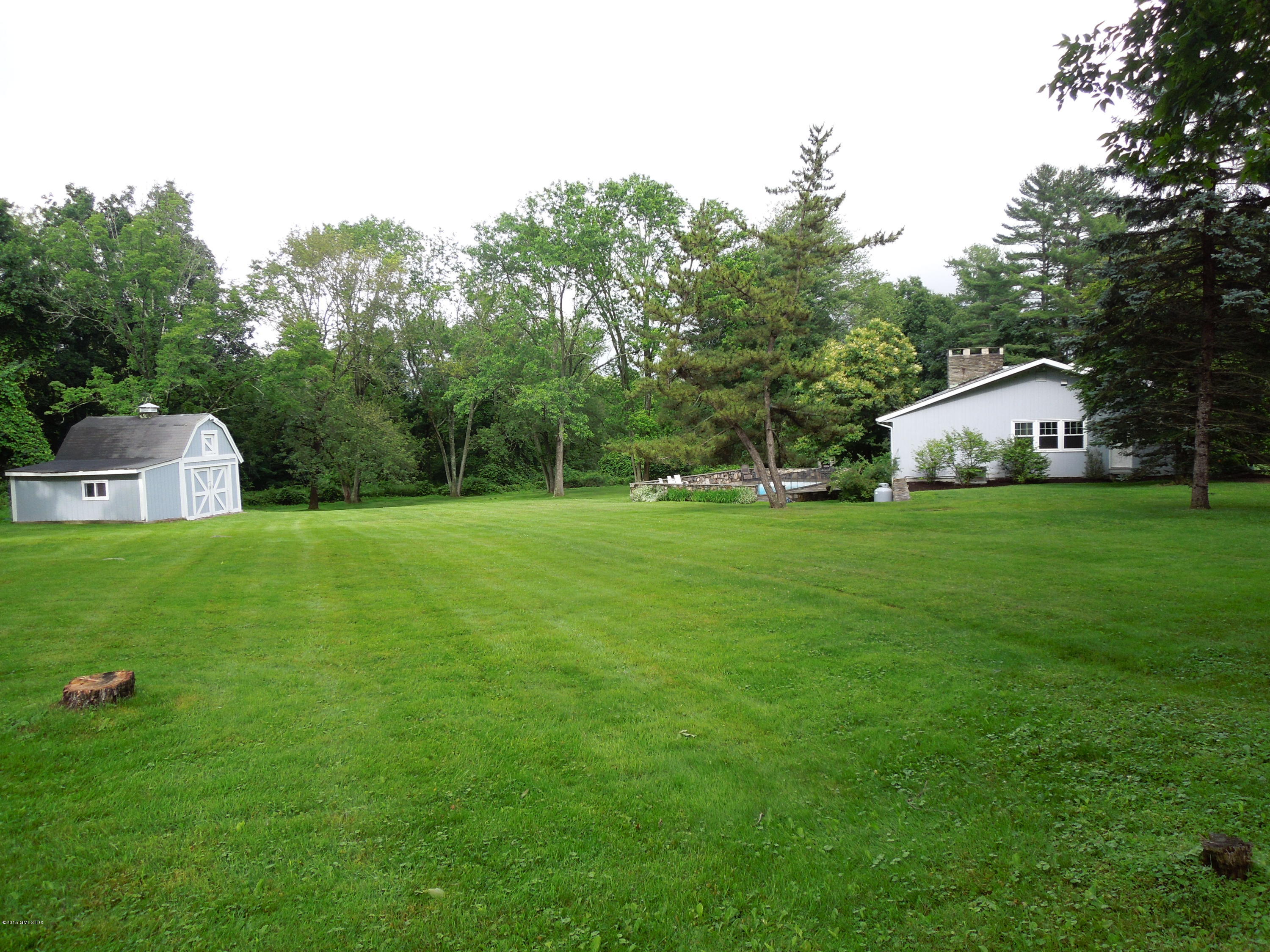 408 Taconic Road Greenwich, CT 06831 - Photo 17 of 18 a view of a house with a big yard