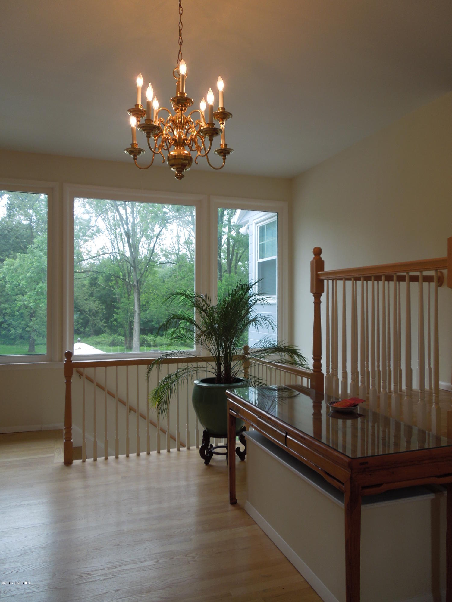 408 Taconic Road Greenwich, CT 06831 - Photo 3 of 18 a room with wooden floor pool table and chairs