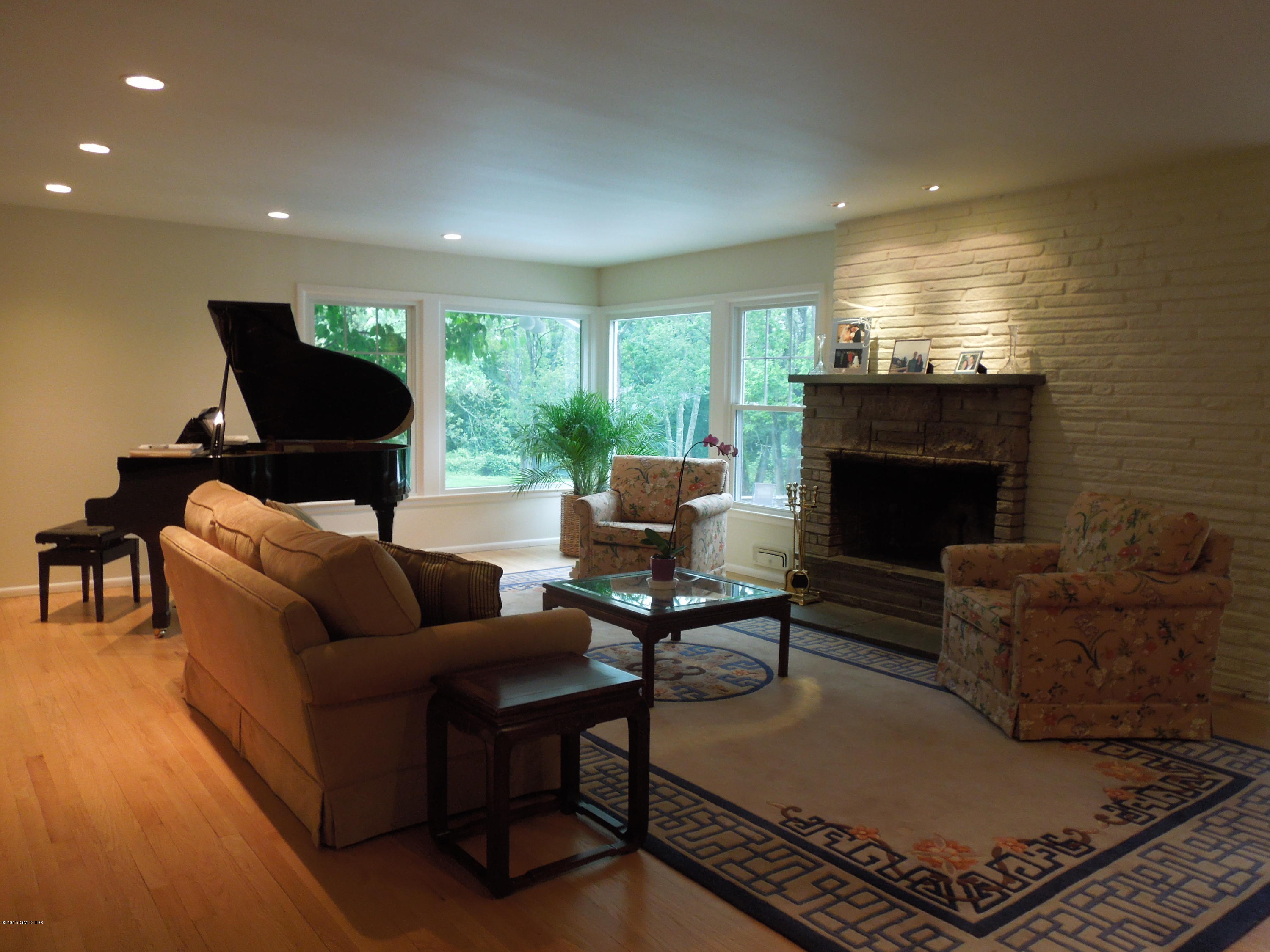 408 Taconic Road Greenwich, CT 06831 - Photo 4 of 18 a living room with furniture and a fireplace