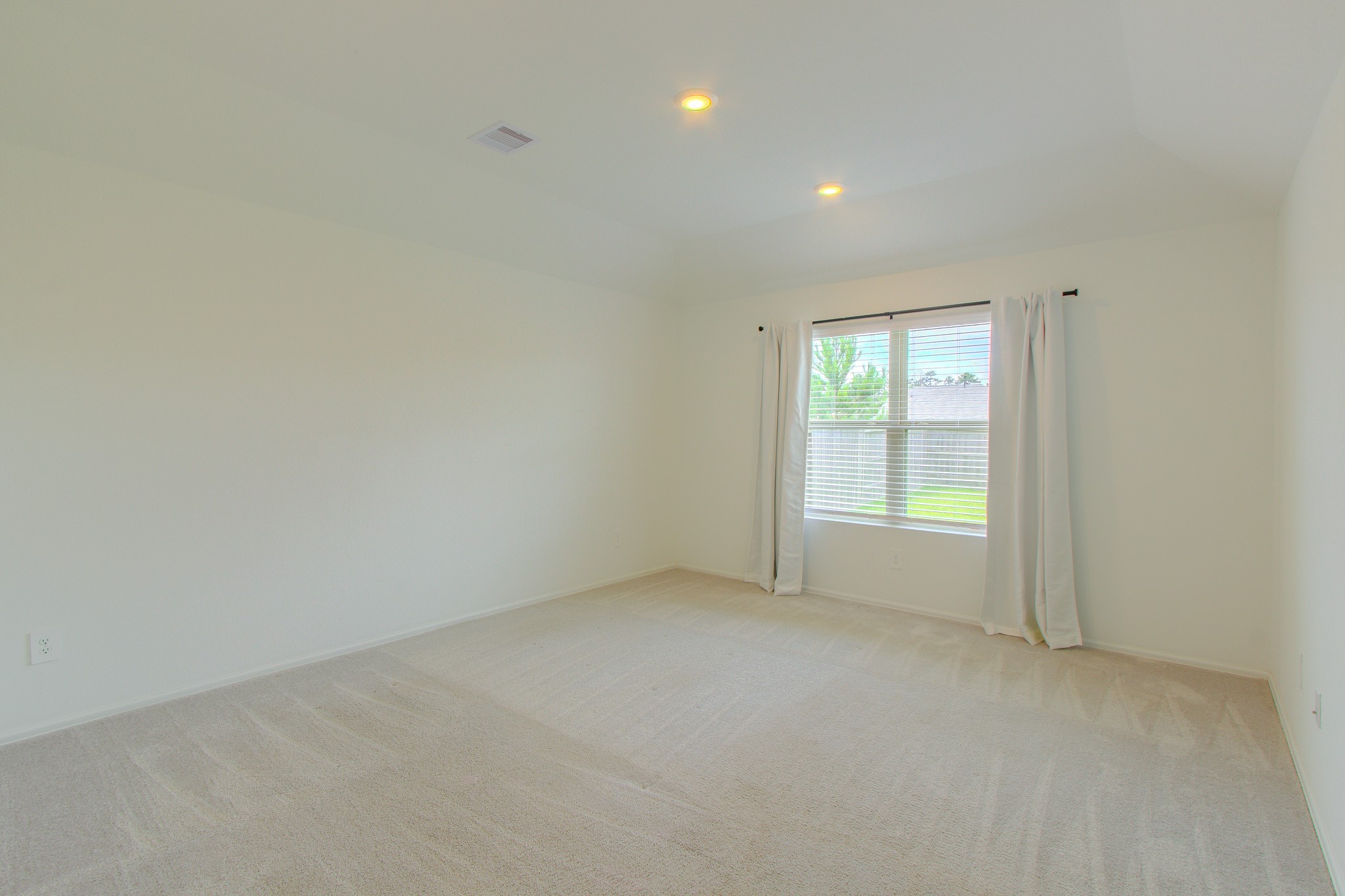 3113 Catalonion Court Conroe, TX 77301 - Photo 22 of 45 an empty room with windows