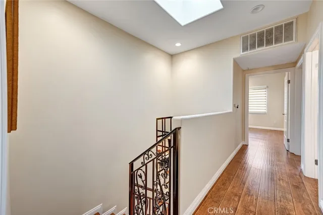 a spacious bedroom with a bed and a couch