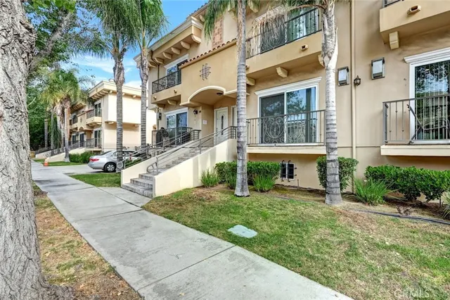 a view of a building with a yard