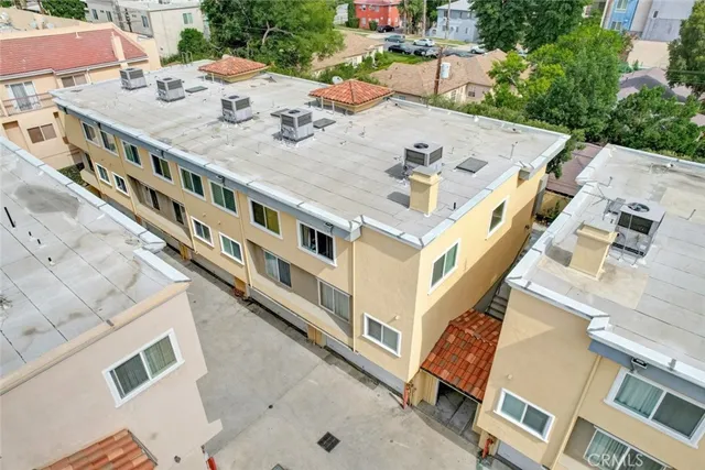 a front view of a building with a yard