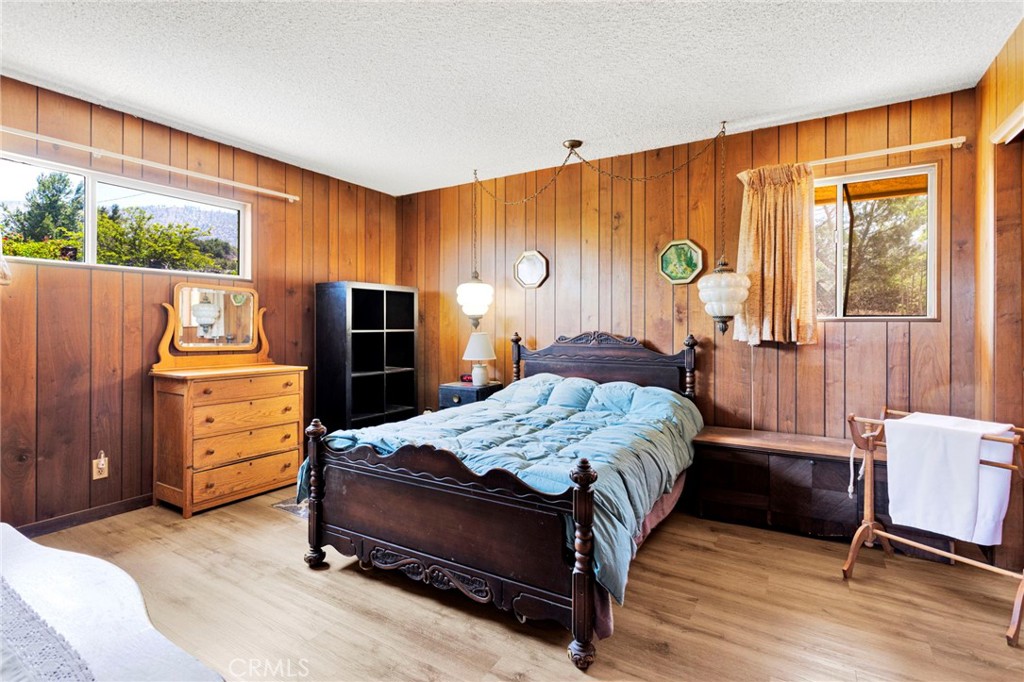 5500 Oil Well Road Phelan, CA 92371 - Photo 21 of 65 a bedroom with a bed and a window