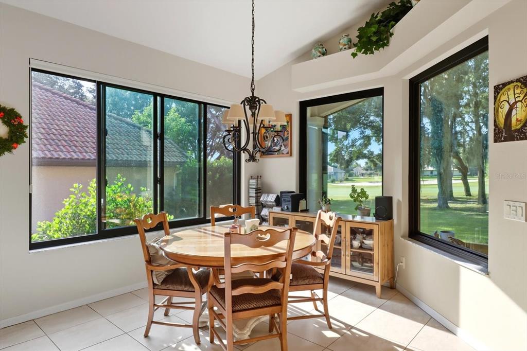 366 West Doerr Path Hernando, FL 34442 - Photo 15 of 47 a dining room with furniture a chandelier and garden