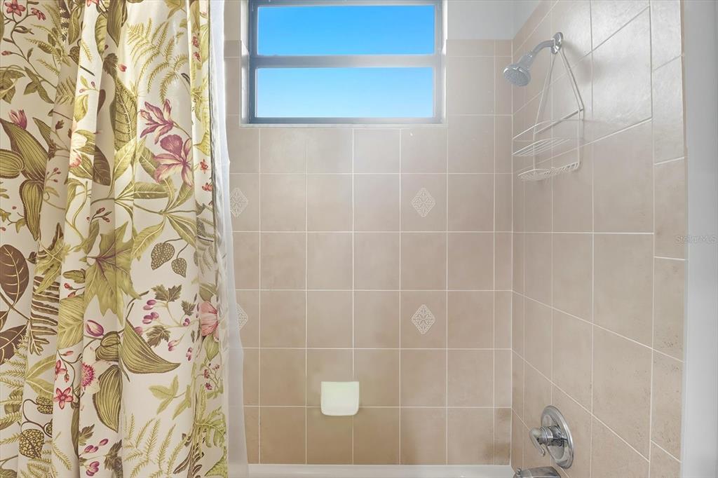 366 West Doerr Path Hernando, FL 34442 - Photo 18 of 47 a bathroom with a shower curtain