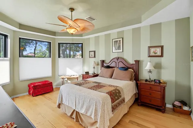 a bedroom with a bed and cabinets