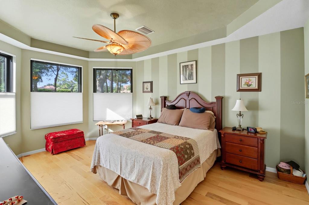 366 West Doerr Path Hernando, FL 34442 - Photo 26 of 47 a bedroom with a bed and a chandelier