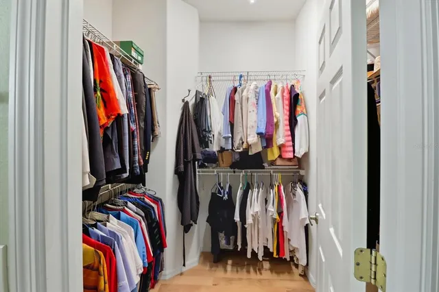 a bathroom with a sink double vanity granite tub shower and mirror