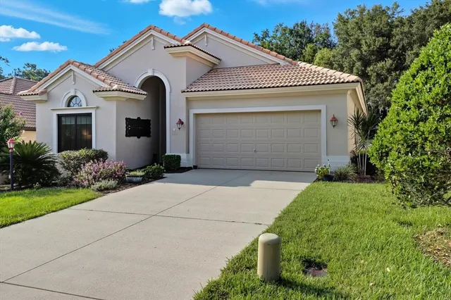 a front view of house with garden
